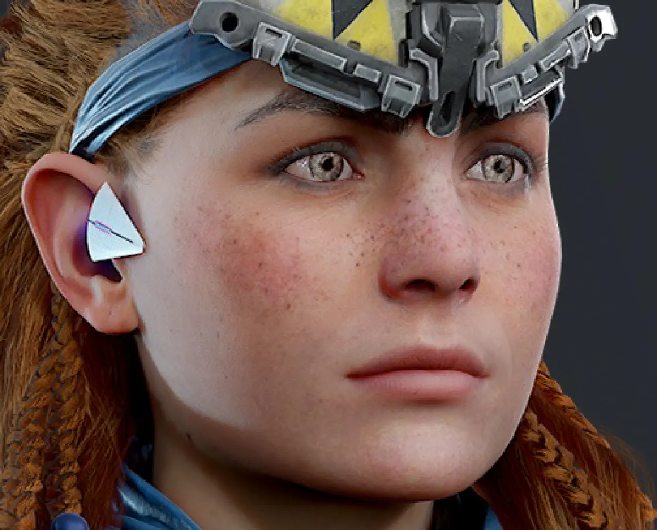 A close up of Aloy's face.