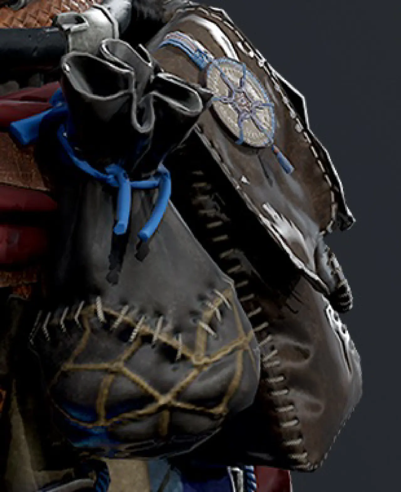 A close up of two pouches on Aloy's belt, one of which has a small coin attached.